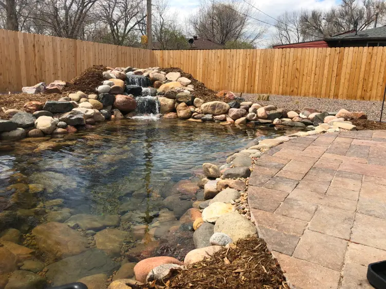 koi pond on edge of patio